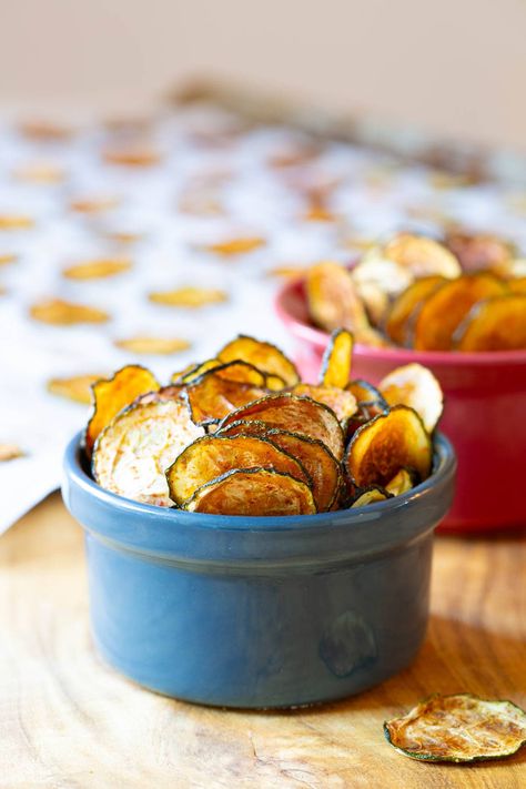 Baked Zucchini Chips in blue bowl Paleo Friendly Snacks, Baked Zucchini Chips, Lighter Recipes, Air Fryer Veggies, Zucchini Chips Recipe, Apple Chips Baked, Christmas Main Dishes, Zucchini Chips Baked, Food Bites