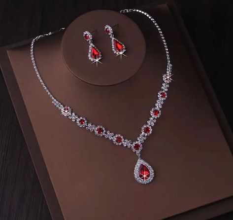 Holiday Special!!! Chic Silver Plated  Necklace & Earrings  Red Rhinestone Crystal Sets Stunning Necklace and Earrings Set Necklace & Earrings Modern Design Set / 287 Red Clear Color - Silver Plated Alloy Brand new  MSRP of this set is $89.00 Buy now before it's gone. You can't go wrong with this elegant set. The upscale craftsmanship and quality. Set is brand new with tag. Prom Dress Accessories Jewelry, Red And Gold Necklace, Red Prom Jewelry, Red And Silver Jewelry, Red Jewellery Set, Necklace With Red Stone, Garnet Jewelry Set, Red Jewelry Set, Necklace And Earring Sets