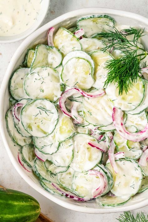 Creamy Cucumber Salad! Ultra velvety with just the right amount of tartness, this creamy cucumber salad is a mix of English cucumbers, red onions, and a rich, flavorful dressing. | HomemadeHooplah.com Cucumber Tomato And Red Onion Salad, English Cucumber Salad Recipe, English Cucumber Salad, Cucumber Salad Dressing, Cucumber Canning, Creamy Cucumber Salad, Creamy Cucumbers, Red Onion Salad, Persian Cucumber