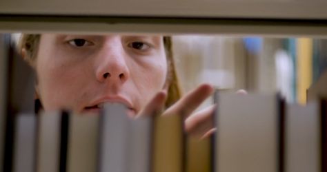 Young man taking a book off a bookshelf in a library - close up shot through shelf Stock Video Footage 00:10 SBV-334166996 - Storyblocks Movie Close Up Shots, Library Photo Shoot, Library Bookshelves, Library Shelves, Take A Shot, Movie Shots, Free Stock Video, Popular Videos, Video Clip