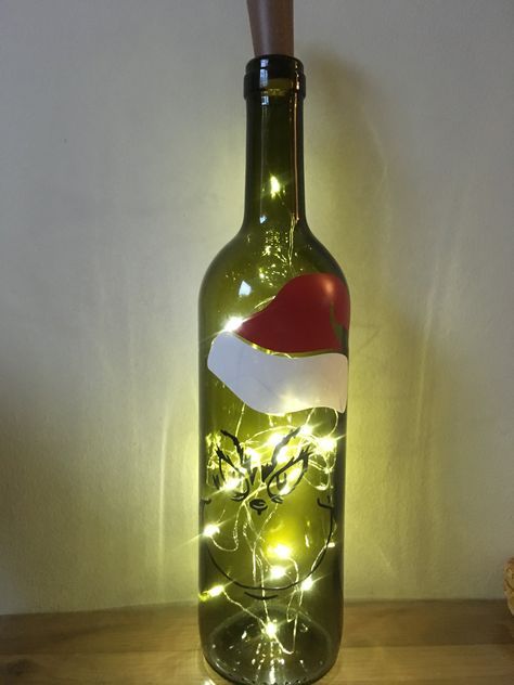 Grinch Painted Wine Bottle, Glass Box Crafts Ideas, Light Up Wine Bottles Christmas, Diy Wine Bottle Crafts With Lights, Fairy Light Bottles, Christmas Wine Bottles With Lights, Christmas Bottle Lights, Wine Bottle Cricut Ideas, Painted Wine Bottles With Lights