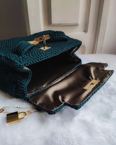 Introducing our stunning handcrafted crochet bag in vibrant emerald green! 👜 Featuring a popular bag opening mechanism, this design combines elegance and functionality, ensuring easy access while keeping your belongings secure. 🔐 With internal reinforcement for a structured shape and a luxurious satin lining, this trapezoid bag is perfect for both special occasions and everyday outings. The golden hardware adds a touch of sophistication to the overall design.🦪♥️ Available in various colors ... Popular Bags, Overall Design, Crochet Bag, Emerald Green, Easy Access, Overalls, Emerald, Special Occasion, Satin