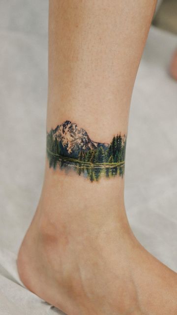 Mountain Range Ankle Tattoo, Mountain Tattoo Colorful, Mountain Arm Band Tattoo For Women, Mountain Tattoo Wrap Around, Watercolor Tattoo Mountain, Large Mountain Tattoo, Watercolor Landscape Tattoo, Montani Semper Liberi Tattoo, Pnw Inspired Tattoo