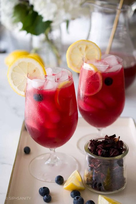 Blueberry Hibiscus Lemonade isn’t just a refreshing drink. It’s made with antioxidant rich ingredients like whole blueberries and real hibiscus flowers. I think it’s pretty common knowledge that blueberries are a superfood and packed with antioxidants, but did you know that hibiscus is another source of antioxidants? Yep! Combined with vitamin C rich lemon juice, this is a pretty good for you summer sipper! Hibiscus Lemonade, Hibiscus Flower Tea, Yummy Summer Cocktails, Dried Hibiscus Flowers, Chicken Base, Fruit Flowers, Hibiscus Tea, Wild Blueberries, Flower Tea