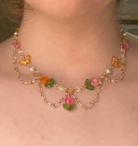 Persephone’s tulips choker (adjustable) $35.00 Now available 🌷 #tulip #tulips #gemstones #gemstonejewelry #literature #dragons #dragon #greekmythology #beadsjewelry #cottagecore #fairycore #smallbusiness #smallbusinessowner #smallbusinesssupport #flowers #flower #flowerjewellery #pink #pinkpinkpink #sunset Tulip Beads, Fairycore Jewelry, Beaded Flowers Patterns, Diy Hair Bows, Girly Jewelry, Beading Tutorials, Flower Jewellery, Beaded Flowers, Jewelry Art