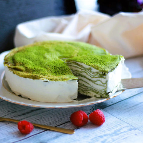 Matcha Mille Crepe Cake is a layered delicacy featuring delicate matcha crepes stacked high with a creamy filling. It offers a perfect balance of sweetness and the earthy richness of matcha.  The texture is particularly delicious as the crepe and whipped cream blend together in your mouth, gradually unraveling and melding into one. Crepe Cake Filling, Matcha Crepes, Matcha Crepe Cake, Matcha Snacks, Mille Crepe Cake, Cake Matcha, Whipped Cream Filling, Crepe Batter, Cake Filling