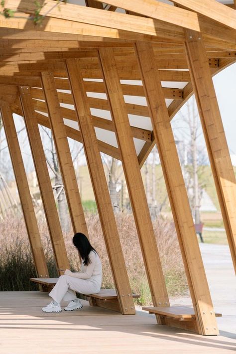 Cycling Pavilion / A.C.R.E. Atelier + School of art design and Media of ECUST | ArchDaily Pavilion Seating Design, Pavilion Architecture Public Spaces, Timber Pavilion, Community Kitchen, Park Pavilion, Building Foundation, Pavilion Architecture, Public Seating, Public Realm