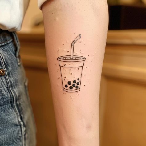 Embrace the simplicity of life with this minimalist bubble tea tattoo, a symbol of joy and comfort. Let its clean lines inspire you to find happiness in the little things. Save & follow for more unique ink inspirations. 🍵✨ #MinimalistTattoo #BubbleTeaInk #InkInspiration #TattooArt #ContemporaryTattoos #JoyfulSymbols #AIimage Boba Tea Tattoo, Bubble Tea Tattoo, Boba Tattoo, Muffin Tattoo, Tea Tattoos, Tatts Ideas, Bubble Tattoo, Small Colorful Tattoos, Tea Tattoo