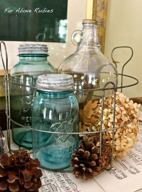 vinegar jugs and blue Mason jars in a vintage canning basket Uses For Old Blue Mason Jars, Decorating With Old Bottles, Blue Mason Jar Decor, Mason Jar Display, Vintage Fall Decor, Jar Display, Jar Projects, Lunch Table, Mason Jar Projects