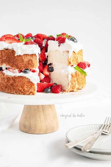 This Angel Food Cake with Berries is SO EASY to make and tastes wonderful paired with fresh fruit and whipped cream - or - just as it is! It's a great summer dessert that doesn't feel heavy or rich. #angelfoodcake #whippedcream #beyondthebutter #coolwhip #angelfood Angel Food Cake With Berries, Fruit Tart Glaze, Homemade Angel Food Cake, Fruit And Whipped Cream, Cake With Berries, Fruit Birthday Cake, Easy Fruit Pizza, Fresh Fruit Tart, Best Summer Desserts