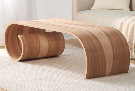 An icon of childhood pursuits is turned on its head in the fluid design of this coffee table of sweet gum veneers over laminated birch plywood. Signed on bottom. Tabletop is 35"W. Overall dimensions listed above. Bent Wood Coffee Table, Curved Furniture Wood, Contemporary Wood Furniture, Bent Wood Table, Curved Wood Coffee Table, Curved Wood Furniture, Wooden Table Design For Living Room, Living Room Table Ideas Modern, Knot Furniture