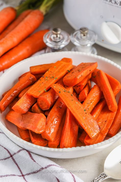 Brighten up that dinner plate with a hearty serving of crockpot carrots. Mild flavored carrots are tossed with a sweet buttery glaze and then cooked long and slow in the crock pot. This recipe is perfect for busy holiday meal preparation, leaving room on the stovetop and oven for everything else! Also delish with beef, chicken and so much more! #crockpotcarrots #brownsugarglazedcarrots #carrotsinthecrockpot #theshortcutkitchen Carrots In The Crockpot, Crock Pot Carrots Slow Cooker, Crock Pot Carrots Glazed, Crock Pot Carrots, Slow Cooker Carrots, Chowder Recipes Crockpot, Corn Chowder Crockpot, Crockpot Carrots, Lentil Sausage