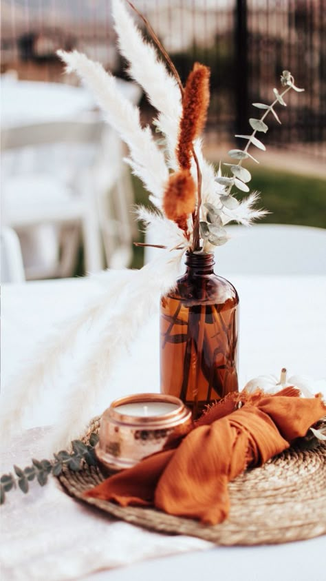 Amber Jar Centerpiece Wedding, Sliced Wood Centerpiece, Simple Wedding Centerpieces Terracotta, Terracotta Wedding Shower Decor, Brown Glass Centerpiece, Terra Cotta And Ivory Wedding, Amber Jars Wedding, Rust Color Wedding Centerpiece, Terracotta Wedding Table Centerpieces