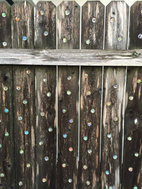 My marble fence Marbles In Fence, Fence With Marbles In It, Marble Fence, Unique Fence Ideas, Spiritual Garden, Fence Stain, Glass Fence, Funky Decor, Fence Art