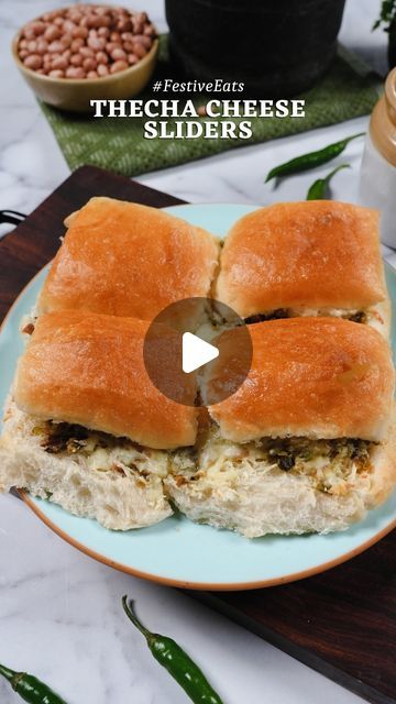 NIKITA SHAH | FOOD & TRAVEL on Instagram: "Thecha Cheese Sliders #FestiveEats 

The perfect spicy, cheesy touch for your festive table! These flavor bombs come together in no time and are super easy to make. Your guests won’t be able to resist it 🤤🤤

Method:
- To make the thecha, heat oil in a pan, add cumin seeds and let them crackle. Now add some garlic cloves, raw peanuts & green chillies. Cook till it turns slightly brown, add salt & mix well
- Transfer into a mortar pestle & pound till you get a coarse paste and your thecha is ready
- Cut the pav into half, spread a generous layer of thecha & top it up with mozzarella cheese
- Sandwich it up, grease the top of the pav with butter, cover with foil & bake till the cheese melts.

[sliders, pav, thecha, chutney, snack ideas, indian snac Foil Bake, Cheese Sliders, Raw Peanuts, Mortar Pestle, Cumin Seeds, Cheese Sandwich, Festive Tables, Cheese Sandwiches, Foodie Recipes