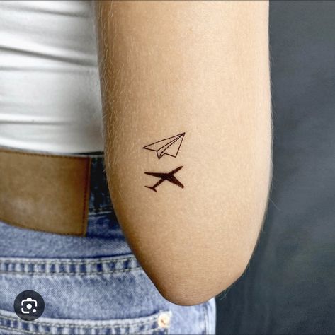 Mini Tattoos Travel, Mini Airplane Tattoo, Tiny Aeroplane Tattoo, Calm Tattoo Ideas, Plane Tattoo Design, Minimalist Travel Tattoo, Small Airplane Tattoos For Women, Airplane Micro Tattoo, Micro Tattoos For Women