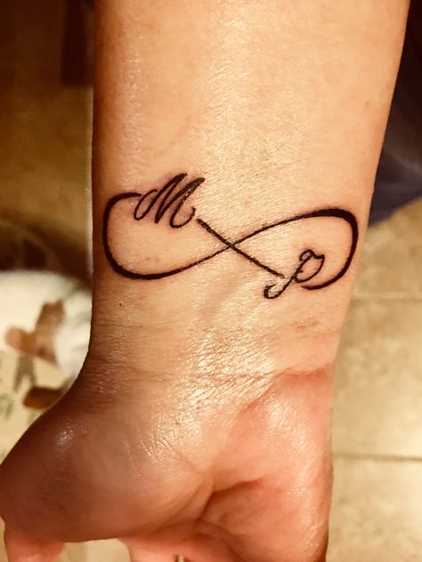 Infinity sign with initials.  Wrist tattoo. Infinity Sign With Initials Tattoo, Infinity Tattoo On Finger With Letter, Mp Tattoo Letter Design, Small Infinity Tattoos With Initials, Infinity Tattoo With Initials, Infinity Tattoo For Men, Mp Tattoo, Wrist Tattoos Quotes, Infinity Sign Tattoo