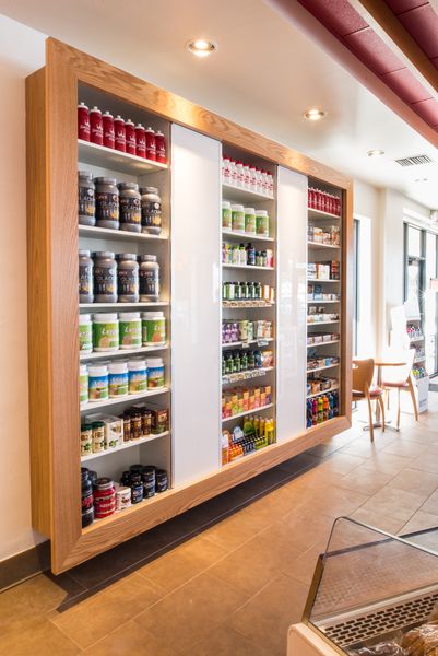 Store supplements display. Nutrition Store Design, Supplement Display Ideas, Supplement Shop Interior Design, Supplement Store Design, Supplement Display, Supplement Shop, Office Reception Design, Pharmacy Decor, Gym Design Interior