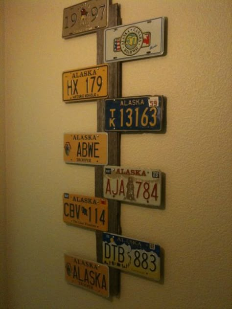 My new creation using Alaska license plates and an old Iowa barn board! How To Display License Plates, Licence Plate Decor, License Plate Ideas Room Decor, Old License Plate Ideas Wall Art, Old License Plate Ideas, License Plate Wall Decor, License Plate Ideas, License Plate Decor, License Plate Wall