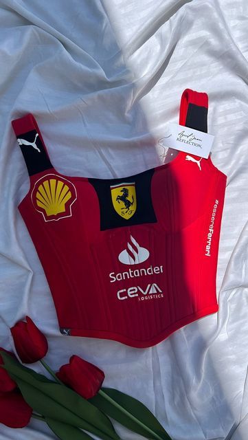 April Jean Libaton on Instagram: "Custom Ferrari corset top inspired by #16 Charles Leclerc! 🏎️ Which F1 driver would you want to see a corset inspired by next? 👀  . . . #Ferrari  #CharlesLeclerc  #F1Fashion  #AprilJeanReflection  #CustomCorset  #FerrariStyle  #f1fashionista  #F1Fashion #FerrariFans #CharlesLeclerc #F1Style #FerrariCorset #CustomClothing #MotorsportFashion #Formula1Merch #HandmadeFashion #racedaystyle" Ferrari Corset, F1 Merch Aesthetic, Ferrari Jersey, Ferrari Clothes, F1 Fits, Ferrari F1 Aesthetic, Ferrari Merch, Custom Ferrari, Formula 1 Merch