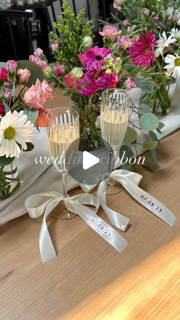 Lauren Emily Wiltse | KC Home Inspiration & Lifestyle (Lindmark) on Instagram: "Send this to someone planning a wedding💍🥂 This is an affordable way to add a unique touch to your wedding day!  Tie these cute custom ribbons onto your champagne glasses for your wedding toast, bachelorette parties, or even use them as a seating chart or gift for guests! There are so many options to add, whether it’s your wedding date, last name, Mr. or Mrs! I may have found this idea a little late, but I am excited to use these on our future anniversaries🍾  Comment DETAILS for an instant DM with 🔗 to these Amazon champagne flutes + the ribbon (ships so fast)!  Prosecco gifted by @proseccodoc_usa 🫶🏼  #amazonfind #affordablewedding #weddingtrend #weddingtoast Amazon wedding, affordable wedding ideas, weddi Ribbon On Champagne Flutes, Affordable Wedding Ideas, Wedding Affordable, Bridesmaid Glasses, Bow Trend, Amazon Wedding, Gift For Guests, Bridal Shower Gifts For Bride, Wedding Toast