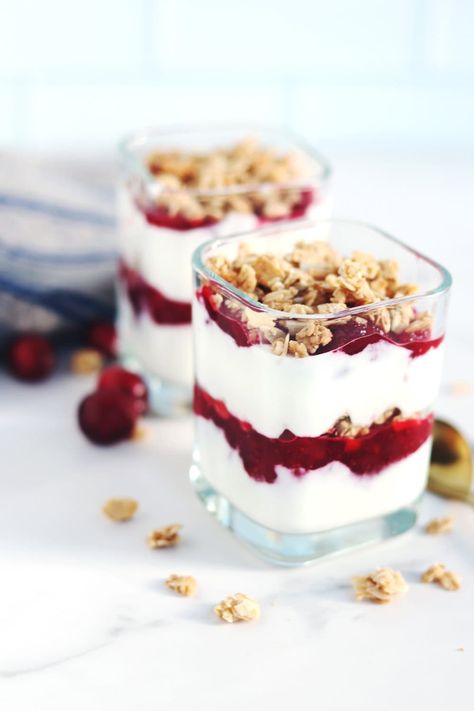 This delightful cranberry parfait recipe features vanilla Greek yogurt, leftover cranberry sauce, and granola; the perfect post-holiday snack! Cranberry Parfait, Cranberry Yogurt, Yogurt Substitute, Homemade Greek Yogurt, Refreshing Breakfast, Parfait Recipe, Jellied Cranberry Sauce, Holiday Snack, Plant Based Yogurt