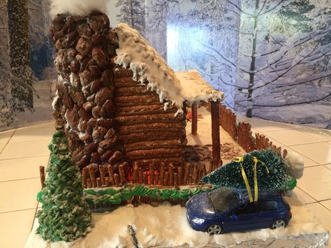 Gingerbread Log Cabin 2017, side, car w/ tree, chimney Gingerbread House Log Cabin Ideas, Gingerbread House With Pretzels, Pretzel House Log Cabins, Gingerbread Log Cabin House Ideas, Gingerbread Cabin Ideas, Cabin Gingerbread House Ideas, Homemade Gingerbread House Ideas, Log Cabin Gingerbread House Ideas, Fun Gingerbread House Ideas