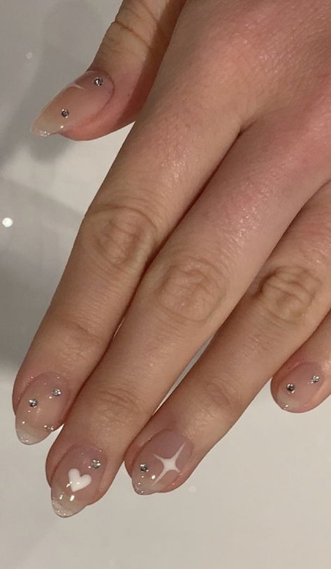 Short almond shape gel x nails with nude base, white heart, white sparkle and simple silver gemstones Short Natural Nails With Rhinestones, Short Gemstone Nails, Nail Designs Jewels, Nails With Nude Base, Short Almond Shape, Natural Almond Nails, Mom Nails, Gem Nail Designs, Cute Easy Nail Designs