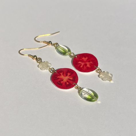 Feeling very springy with this flower & tomato pair! 🍅🌼 ——— Handcrafted by Rachel! ~SOLD~ #jewelry #handmadejewelry #earrings #tomato #resin #charms #beads Funky Jewelry, Resin Charms, Polymer Clay Crafts, Clay Crafts, Polymer Clay, Handmade Jewelry, Charms, Beads, Quick Saves