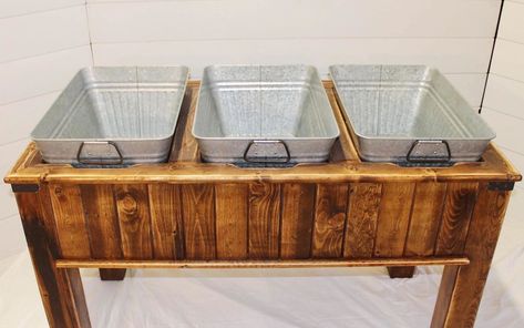 This galvanized beverage tub with stand makes for an attractive beverage and ice bucket at your wedding or event. Our clients love using each of the three metal drink tubs for different beverages. In addition, the rustic wood stand is a stylish addition to your party’s theme. | Wood N Crate Rentals #arizonawedding #modernwedding #mesawedding #weddingrentals #rusticwedding Outdoor Beverage Station Ideas, Wedding Beer Cooler Ideas, Drink Trough Wedding, Beverage Tub Ideas, Buffet Table Arrangement, Drink Tub, Wedding Dessert Table Decor, Lakefront Wedding, Wooden Cooler