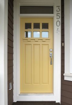 Turquoise Haze paint by Benjamin Moore makes the front door a focal point in a Venice, California, Craftsman bungalow designed by Toddy Nicke and Amy Kehoe. Description from pinterest.com. I searched for this on bing.com/images Yellow Front Door, Best Front Door Colors, Front Door Color, Tan House, Yellow Front Doors, Best Front Doors, Black Shutters, Front Door Paint Colors, Yellow Door