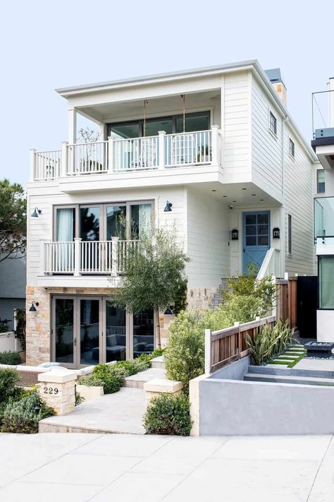 See this stunningly beautiful coastal style farmhouse in Manhattan Beach Manhattan Beach Homes, French Limestone Fireplace, Tiered Seating, Beach House Exterior, Stone Facade, Coastal Modern, Beach Homes, Beach Bungalows, South Bay