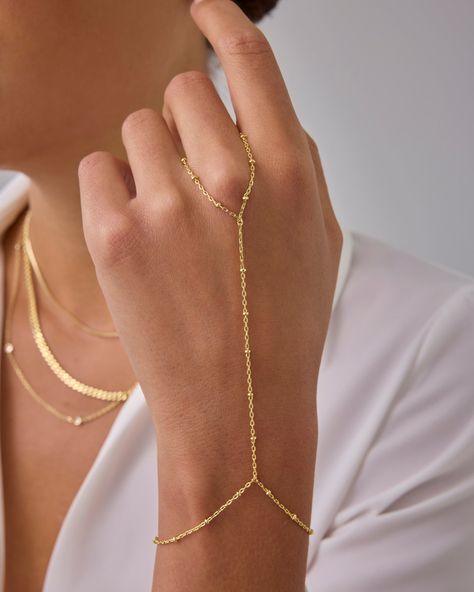 Your best outfits deserve this hand chain — 14K gold plated with bead detailing for the perfect amount of delicate bling to complete every look. Plus, it's sensitive-skin safe and made without nickel, cadmium, or lead. Hand Chains Gold, Handchains Gold, Hand Chain Bracelet Gold, Gold Hand Chain, High Support Bra, Collection Board, Permanent Jewelry, Arm Jewelry, Ring Chain