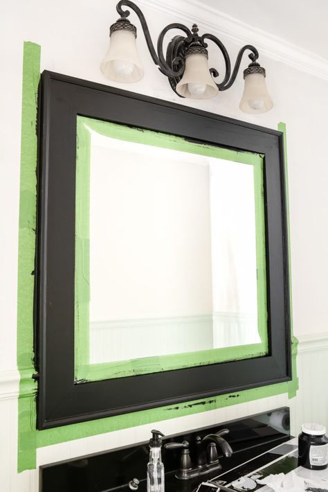 Painting Bathroom Mirror Frame, Plain Mirror Makeover, Repainting Mirror Frame, Diy Black Mirror, Painted Bathroom Mirror, Painting Shower Frame Black, Cheap Mirror Makeover, How To Spray Paint Mirror Frame, Mirror Frame Painting