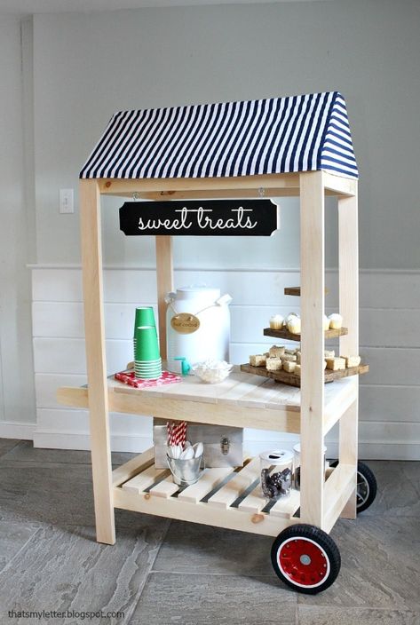 A DIY tutorial to build a kids size street vendor cart perfect for pretend play. Free plans include service area with storage shelf, awning and push handle. Street Vendor Cart, Vendor Cart, Decoration Buffet, Diy Kids Furniture, Toy Diy, Street Vendor, Woodworking Projects For Kids, Woodworking For Kids, Sewing Projects For Kids