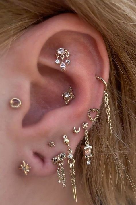 We love getting to see what @adornedbyamelia (IG) adds to her stunning ear curation!  Visit Amelia at Scarecrow Galleries Tattoo for styling needs of your own.  Amelia wears: Stargazer - Flat⁠ Cherish with Diamond - Mid helix⁠ Lucidity - Conch⁠ Heart In Chains - Low helix ⁠ No Masters - Lobe ⁠ Sparkle Motion - Lobe⁠ Chain Reaction Traditional - Lobes Low Helix Piercing, Mid Helix Piercing, Septum Earrings, Ear Curation, Flat Piercing, Helix Piercing Jewelry, Piercing Studio, Chain Reaction, Helix Piercing