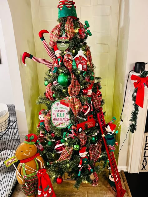 Themed Trees For Kids, Elf Legs Christmas Tree, Christmas Tree Elf Theme, Elf The Movie Christmas Tree, Elf Tree Christmas, Elf Themed Christmas Decor, Elf Themed Christmas Tree, Christmas Contests, Trees For Kids