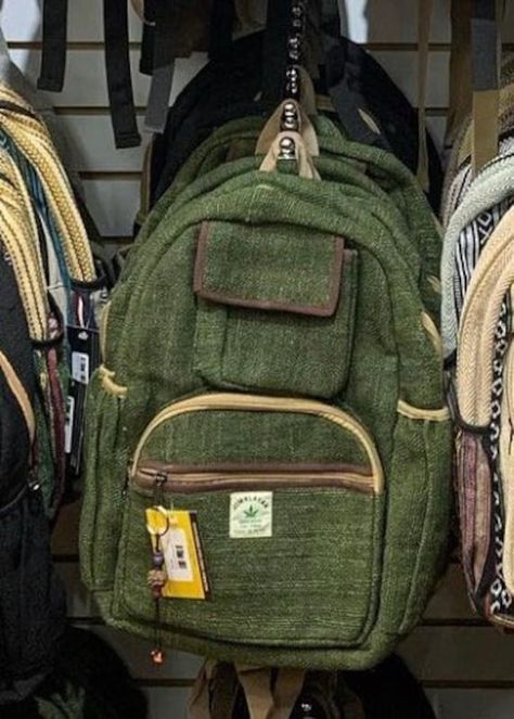 This Olive Green backpack is made from 100% hemp materials and it is beautifully handcrafted in Nepal, they are high quality and this backpack has everything you need. You will not find better quality bag anywhere else. All of our bags are sourced from the mountainous regions of Nepal and are all 100% Handmade. This exclusive backpack and print feature compartments and can fit an I-Pad, along with 2 separate zippered compartments and 2 pockets, extremely strong construction,  two zippers in main compartment for anti-theft prevention, and soft padded straps and made from 100% Hemp, the entire bag is extremely strong but also breathable. Not available in stores, don't miss out on this fantastic buy. THANK YOU KULTURAL VIBEZ Granola Bag Aesthetic, Cryptidcore Bag, Adventurer Bag, Green Backpack Aesthetic, Canvas Backpack With Pockets, Green Backpack, Backpacks Aesthetic, Backpack With Pins, Hippie Backpack