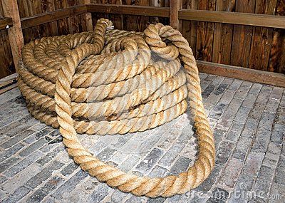 A coil of thick shipping rope on the stone floor of a shed. Rope Drawing, Coiled Rope, Stone Floor, Mermaid Drawings, White Drawing, Black And White Drawing, Random Pics, Stone Flooring, The Stone