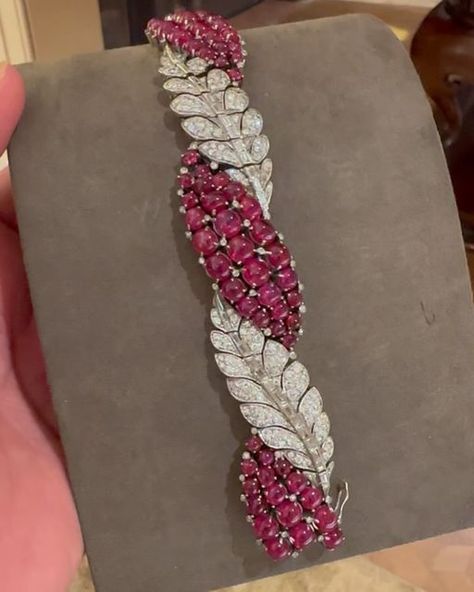 FD GALLERY on Instagram: "Ruby And Diamond Bracelet, Designed as a panel bracelet with pave-set diamond articulated leaf panels alternating with three navette shaped panels of cabochon rubies, mounted in white gold, circa 1950  Size/Dimensions: 7 1/2 inches in length  Diamonds: Total approximate weight 10 carats  Rubies: Approximately 80 cabochons  Gross Weight: 79.1 grams  REF No. P-1693" Diamond And Ruby Bracelet, Ruby Bracelets, Ruby Bracelet, Exclusive Jewelry, Fantasy Jewelry, Diamond Bracelet, Ruby, Jewelry Design, White Gold