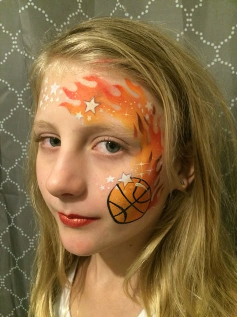 Basketball face painting Artist: Angie the Fairy from Fairies and Other Mischief Face Paint Basketball, Basketball Face Paint Ideas, Face Painting Basketball, Sports Face Paint Ideas, Sport Face Paint, Basketball Face Paint, Sports Face Paint, Crazy Makeup Ideas, Disney Face Painting