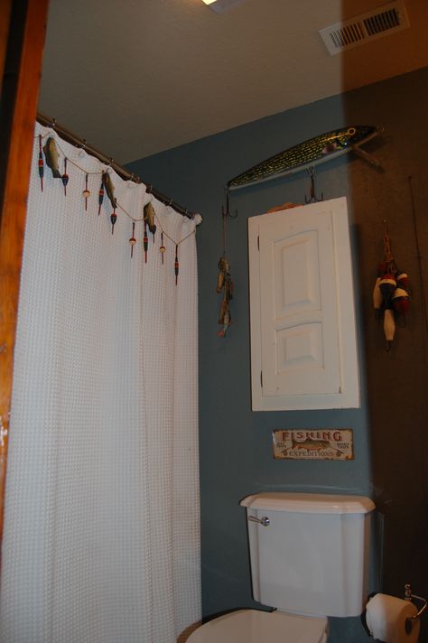 Another view of the boy's fishing bathroom with the fishing garland on the shower curtain Rustic Fishing Bathroom, Fishing Theme Bathroom, Fishing Bathroom Ideas, Fishing Themed Bathroom, Fishing Bathroom, Fishing Bathroom Decor, Camp Bathroom, Fisherman's Cottage, Themed Bathroom Decor