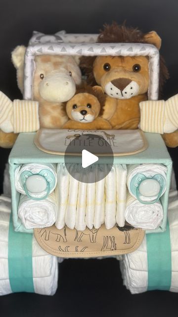 Diaper Creations Diy, Diaper Cakes For Baby Boy, Safari Diaper Cake Boy, Diaper Jeep Instructions, Diaper Jeep, Nappy Cake Ideas Diy Boy, Safari Theme Diaper Cake, Jeep Diaper Cake, Jeep Diaper Cake Instructions