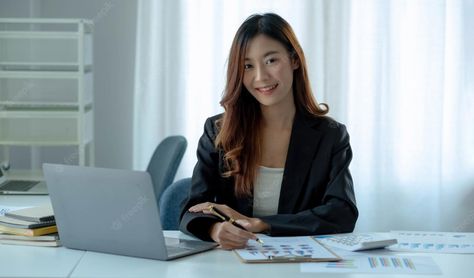 Premium Photo | Charming asian woman working at the office using a laptop looking at the cameraxa Romanian Women, Woman Office, Accounting Firm, White Photo Frames, Female Directors, Female Office, Work Pictures, Office Pictures, Office Outfits Women