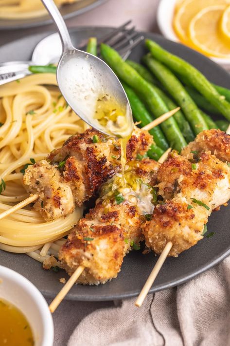 Absolutely delicious and easy to put together, chicken spiedini are skewered chicken bites coated with Italian seasoned breadcrumbs. Grilled until crispy, and served with a super flavorful herb butter sauce, this fun recipe will become a favorite of yours and anyone you serve it to! Butter Chicken Skewers, Chicken Spiedini, Skewered Chicken, Herb Butter Sauce, Lemon Herb Chicken, Italian Breadcrumbs, Lemon Butter Chicken, Lemon Herb, Chicken Bites