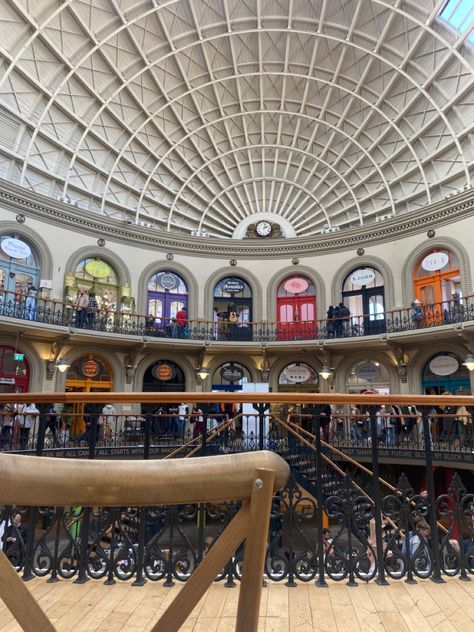 A grand staircase leading to two floors of many shops with colourful doors, very aesthetic and fun! Leeds Corn Exchange, Colourful Doors, Door Color, The Circle, Leaning Tower, Leaning Tower Of Pisa, Leeds, Pisa, Yorkshire