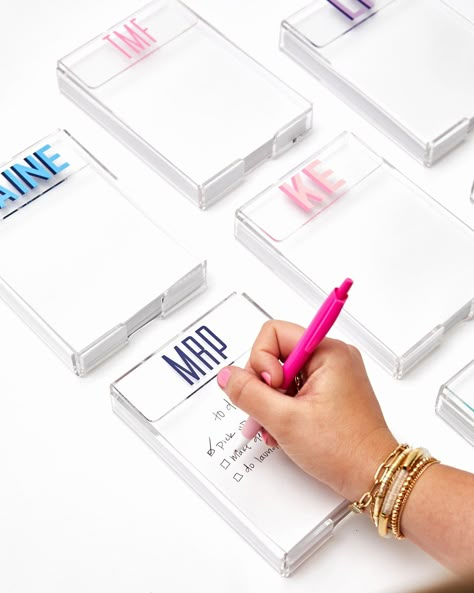 "Say goodbye to boring desk accessories with this Acrylic Notepad. Its snazzy holder will give your workspace a personal touch -- just customize with your name or monogram in your favorite color and watch the envy ensue! Elevate your desk style, quickly and easily. Let the creativity commence! Details: -Material: Acrylic -Dimensions: 4.5\" x 6.5\" x 1.25\" -150 sheets of paper are included Please let us know if you have any questions at all! ----------------------------------------------------------------- SHIPPING All orders are shipped via USPS via the options below. Our shop can guarantee when your order is delivered to the post office but are not responsible for any delays from USPS. Days below are for domestic only. First Class Packages - 2-5 Days estimated Priority Mail - 4-5 Days es From The Desk Of Stationary, Personalized Desk Accessories, Desk Styling, Personalized Desk, Sheets Of Paper, Personalized Notepad, Senior Gifts, Bachelorette Trip, Grad Gifts