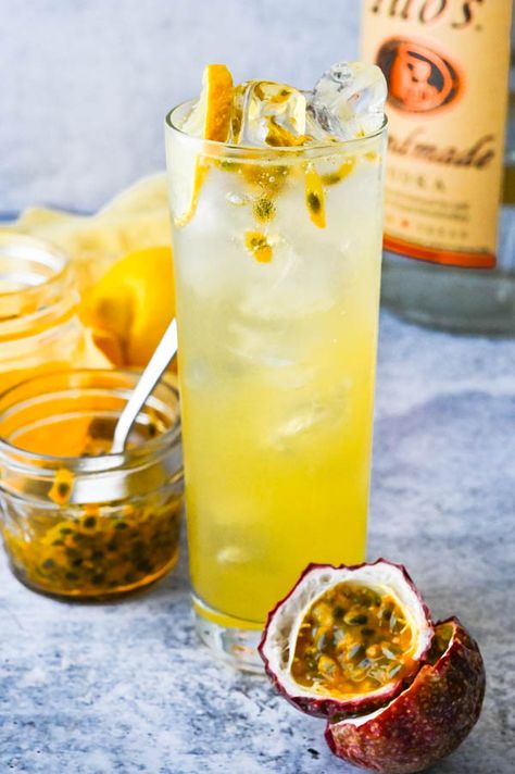 This quick and easy homemade passion fruit vodka soda cocktail is a tropical, quenching summer drink made with passion fruit simple syrup, fresh lemon juice, vodka and sparkling water or club soda. Make it by the glass or by the pitcher for a simple, fresh, tropical summer sipper everyone loves. #passionfruitcocktail #vodkasoda Passionfruit Vodka Cocktail, Fruit Vodka Drinks, Fruit Simple Syrup, Vodka Soda Cocktails, Passionfruit Cocktail, Passion Fruit Cocktail, Water With Lemon, Passionfruit Recipes, Easy Summer Cocktails