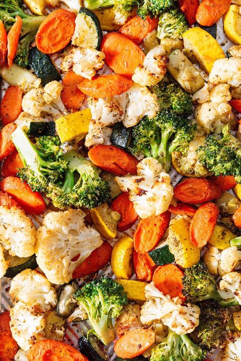 Made with vegetables that span the colors of the rainbow, this roasted vegetable medley is an easy way to cook flavor-packed veggies! Tossed in just a light coating of oil and salt, the neutral flavors allow the vegetables to really shine. Plus, I've included a wide array of other veggies this method works with as well as how to cook them in the air fryer! Legumes List Of, Best Way To Eat Vegetables, How To Season Vegetables, How To Roast Frozen Vegetables, Grilled Veggies In Oven, Baked Vegetables Roasted Veggies, How To Roast Vegetables In The Oven, Vegan Roasted Vegetables, Best Roasted Veggies