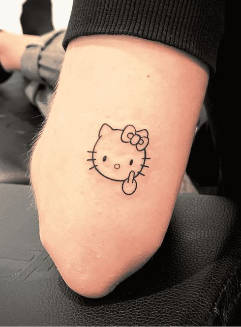 Hello Kitty Tattoo Design Images (Hello Kitty Ink Design Ideas) Hello Kitty Tattoo For Men, Hello Kitty Skull Tattoo, Hello Kitty Fine Line Tattoo, Hello Kitty Tattoo Ideas Design, Emo Hello Kitty Tattoo, Hello Kitty Outline Tattoo, Matching Tattoos Hello Kitty, Hello Kitty Henna Design, Hello Kitty Tattoo Small